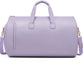 Lavender duffel bag with gold accents on a white background